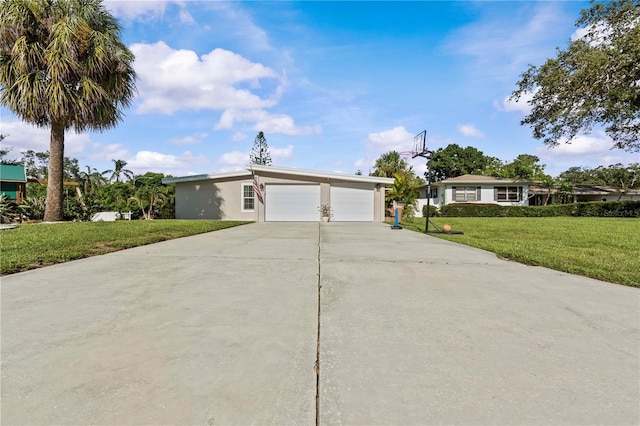 327 Sunny Ln, Belleair, FL 33756 - single story home with driveway, a front yard, a garage, and stucco siding