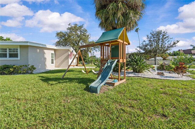 327 Sunny Ln, Belleair, FL 33756 - view of jungle gym with a lawn