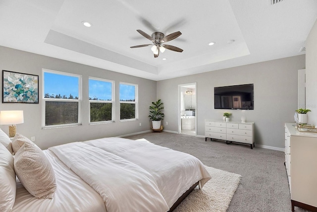 1192 Multiflora Loop, Lutz, FL 33558 - bedroom featuring a tray ceiling, recessed lighting, light carpet, connected bathroom, and ceiling fan