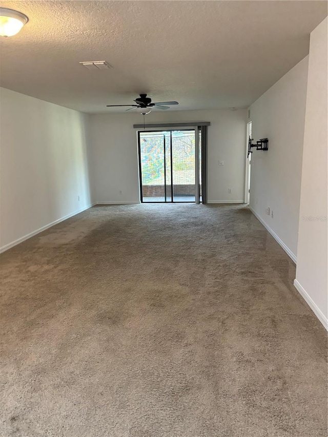 5578 Maggiore Blvd, Lakeland, FL 33805 - spare room featuring a ceiling fan, carpet flooring, and a textured ceiling
