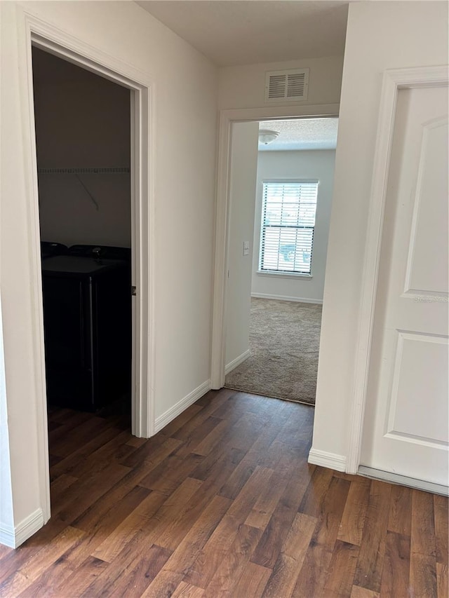 5578 Maggiore Blvd, Lakeland, FL 33805 - corridor featuring washer / dryer and dark wood finished floors