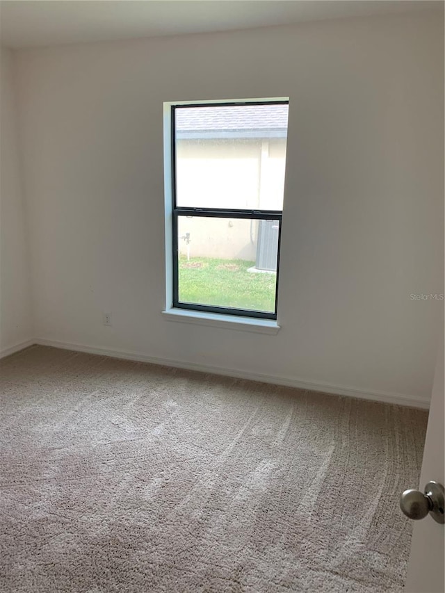 5578 Maggiore Blvd, Lakeland, FL 33805 - carpeted empty room featuring baseboards