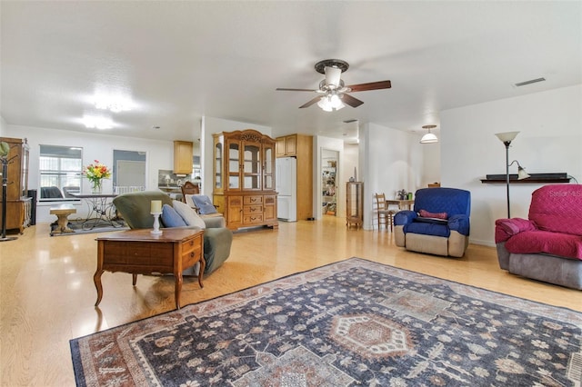 70 Arthur Ln, Winter Haven, FL 33880 - living area featuring ceiling fan and light wood-style flooring