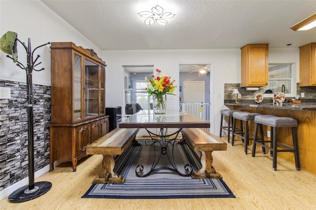 70 Arthur Ln, Winter Haven, FL 33880 - dining space with light wood-style flooring, a textured ceiling, and a ceiling fan