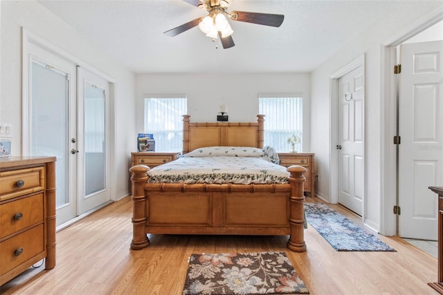 70 Arthur Ln, Winter Haven, FL 33880 - bedroom featuring light wood-style floors, multiple windows, and a ceiling fan