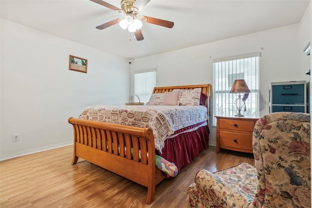 70 Arthur Ln, Winter Haven, FL 33880 - bedroom featuring multiple windows, wood finished floors, and a ceiling fan
