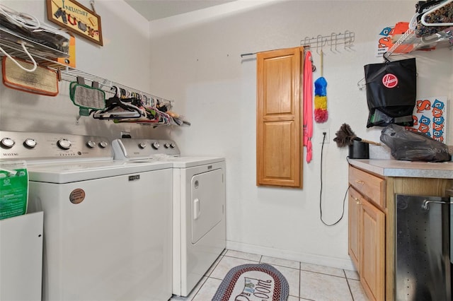 70 Arthur Ln, Winter Haven, FL 33880 - washroom featuring washing machine and dryer, light tile patterned flooring, and cabinet space