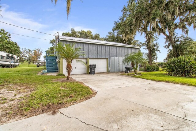 70 Arthur Ln, Winter Haven, FL 33880 - garage featuring concrete driveway