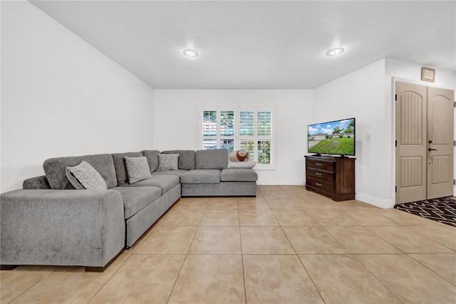 12402 84th Way, Largo, FL 33773 - living room with light tile patterned floors and baseboards