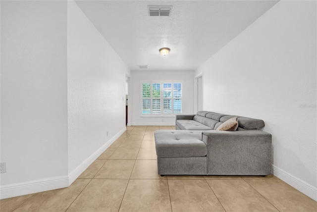12402 84th Way, Largo, FL 33773 - living room with baseboards and light tile patterned floors