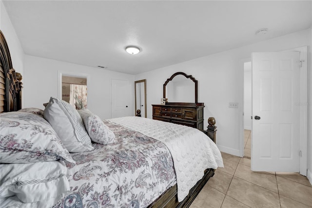 12402 84th Way, Largo, FL 33773 - bedroom featuring light tile patterned floors and baseboards