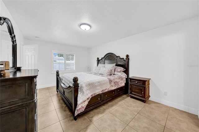 12402 84th Way, Largo, FL 33773 - bedroom with light tile patterned floors and baseboards