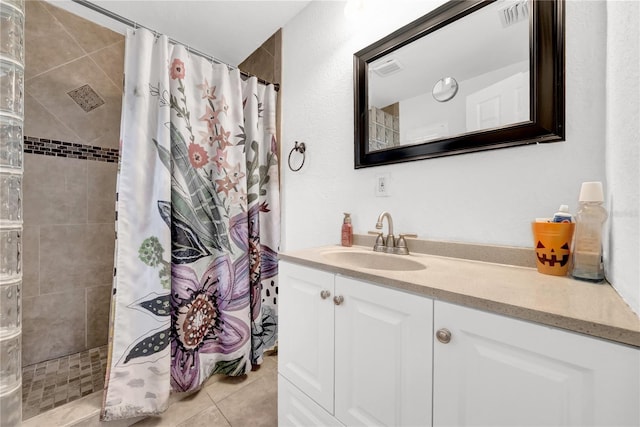 12402 84th Way, Largo, FL 33773 - full bathroom with vanity, tiled shower, and tile patterned flooring
