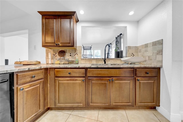 12402 84th Way, Largo, FL 33773 - kitchen featuring tasteful backsplash, brown cabinets, and light tile patterned flooring