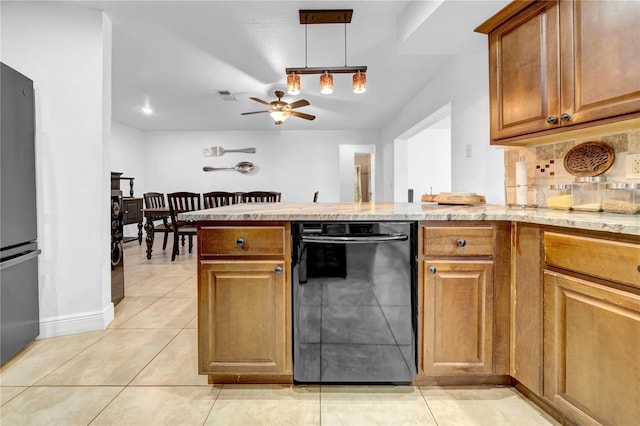 12402 84th Way, Largo, FL 33773 - kitchen featuring dishwasher, freestanding refrigerator, backsplash, light stone counters, and ceiling fan