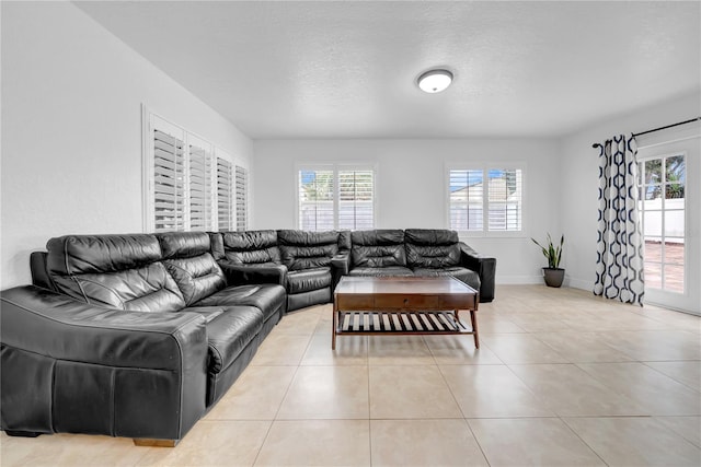 12402 84th Way, Largo, FL 33773 - living room with plenty of natural light, light tile patterned floors, and a textured ceiling