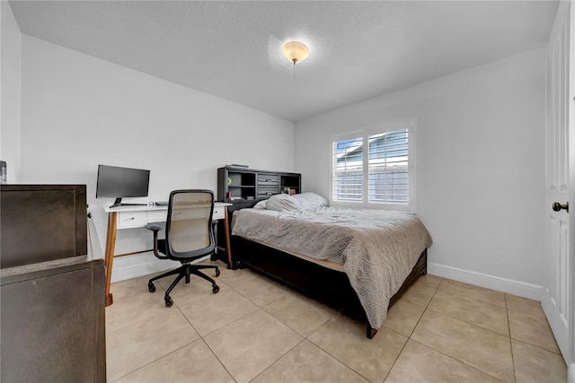 12402 84th Way, Largo, FL 33773 - bedroom featuring an office area, light tile patterned floors, and a textured ceiling