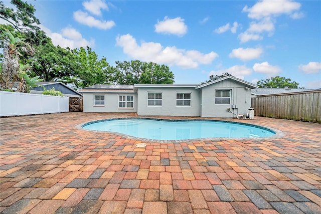 12402 84th Way, Largo, FL 33773 - view of pool featuring a fenced backyard and a patio area