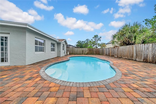 12402 84th Way, Largo, FL 33773 - view of pool featuring a fenced backyard and a patio