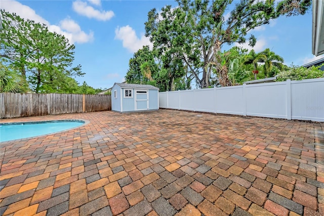 12402 84th Way, Largo, FL 33773 - view of swimming pool with a patio area, a shed, and a fenced backyard
