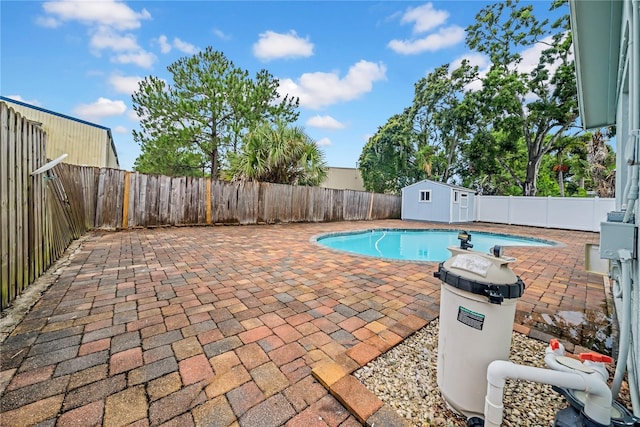 12402 84th Way, Largo, FL 33773 - view of pool with a fenced backyard, a patio, and a shed