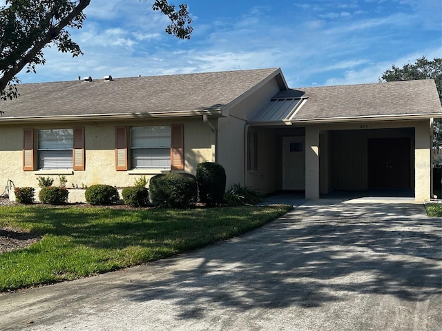 405 Gladstone Pl Unit 0, Sun City Center, FL 33573 - ranch-style house featuring a front lawn, stucco siding, driveway, and a shingled roof