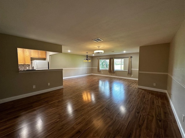 405 Gladstone Pl Unit 0, Sun City Center, FL 33573 - unfurnished living room featuring dark wood-style floors