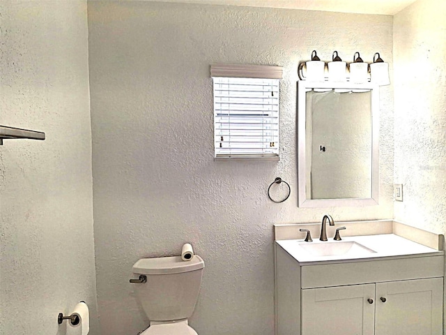 450 82nd Ave, St Pete Beach, FL 33706 - bathroom featuring vanity and a textured wall