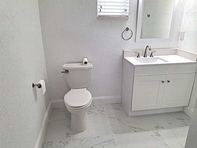 450 82nd Ave, St Pete Beach, FL 33706 - bathroom featuring a textured wall, marble finish flooring, and vanity