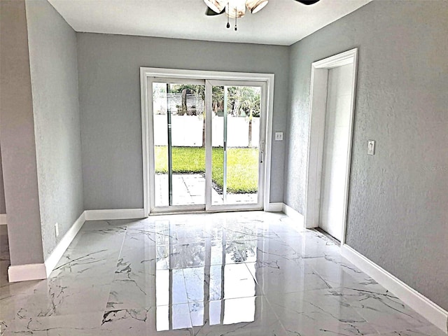 450 82nd Ave, St Pete Beach, FL 33706 - empty room with marble tiled floors and a ceiling fan