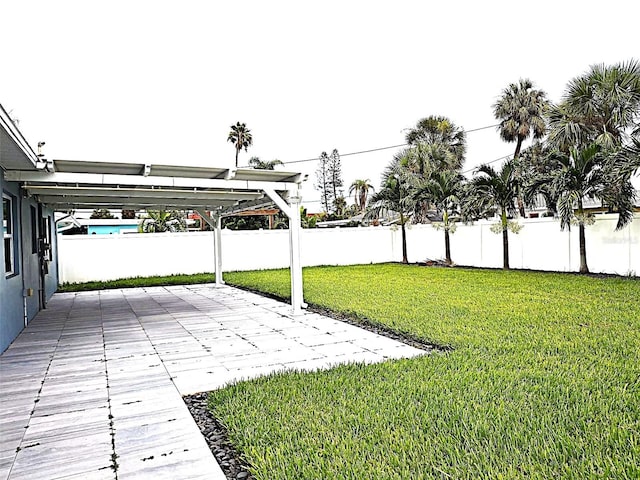 450 82nd Ave, St Pete Beach, FL 33706 - fenced backyard with a patio area