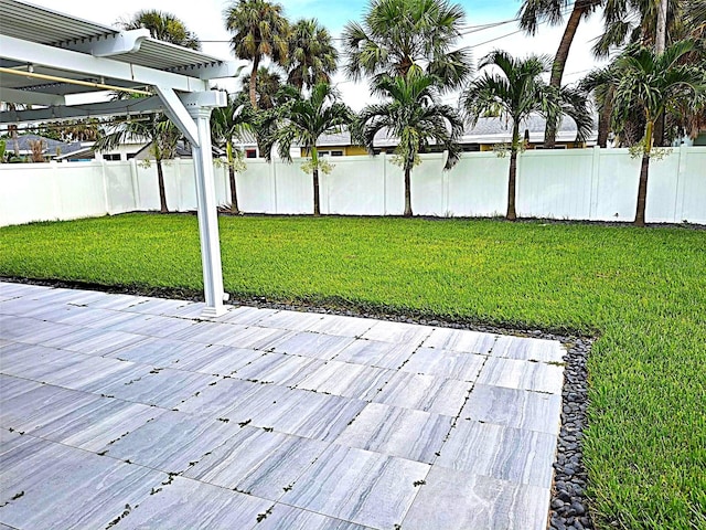 450 82nd Ave, St Pete Beach, FL 33706 - wooden terrace featuring a pergola, a fenced backyard, and a patio