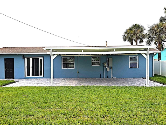 450 82nd Ave, St Pete Beach, FL 33706 - rear view of house featuring stucco siding and a patio