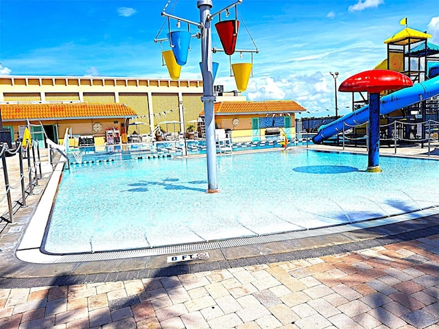 450 82nd Ave, St Pete Beach, FL 33706 - community pool featuring a water slide and a water play area