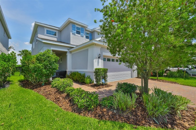 6215 Voyagers Pl, Apollo Beach, FL 33572 - view of front facade featuring stucco siding and decorative driveway