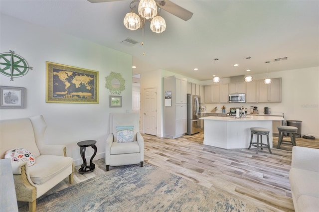 6215 Voyagers Pl, Apollo Beach, FL 33572 - living room with a ceiling fan, light wood finished floors, and recessed lighting