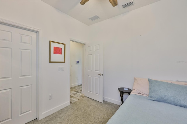 6215 Voyagers Pl, Apollo Beach, FL 33572 - bedroom with light colored carpet and ceiling fan