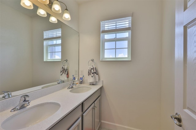 6215 Voyagers Pl, Apollo Beach, FL 33572 - full bathroom with double vanity and baseboards
