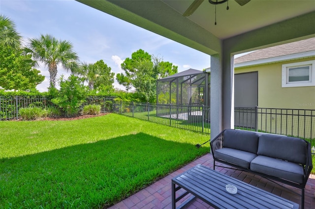 6215 Voyagers Pl, Apollo Beach, FL 33572 - fenced backyard with outdoor lounge area, a patio area, and ceiling fan