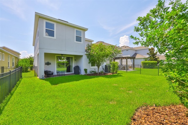 6215 Voyagers Pl, Apollo Beach, FL 33572 - back of house featuring stucco siding and a fenced backyard