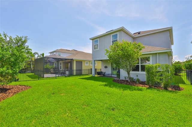 6215 Voyagers Pl, Apollo Beach, FL 33572 - back of property with stucco siding, a fenced backyard, and a shingled roof