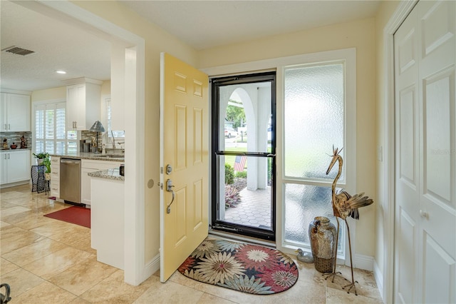 1954 Arvis Cir W, Clearwater, FL 33764 - entrance foyer with recessed lighting and light tile patterned floors