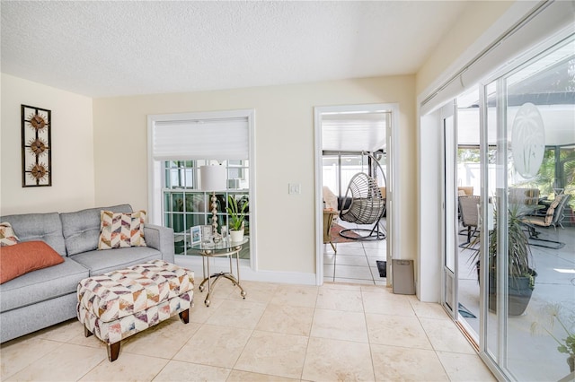 1954 Arvis Cir W, Clearwater, FL 33764 - living room with light tile patterned floors and a textured ceiling