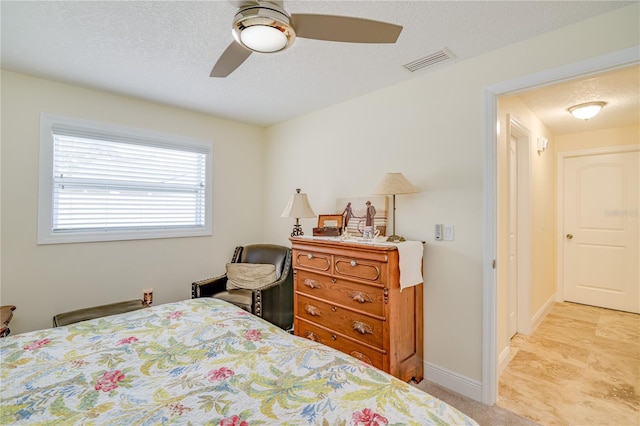 1954 Arvis Cir W, Clearwater, FL 33764 - bedroom with ceiling fan and a textured ceiling
