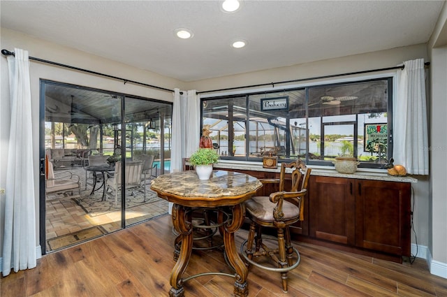 3539 Lake Padgett Dr, Land O Lakes, FL 34639 - dining room with wood finished floors, recessed lighting, and bar area