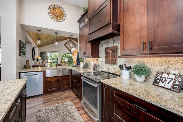3539 Lake Padgett Dr, Land O Lakes, FL 34639 - kitchen with stainless steel appliances, light wood-style flooring, decorative backsplash, light stone counters, and hanging light fixtures