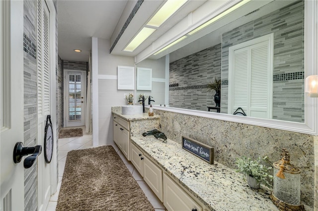 3539 Lake Padgett Dr, Land O Lakes, FL 34639 - full bathroom featuring tile patterned floors, vanity, backsplash, and a closet