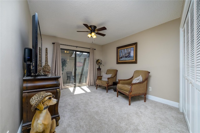 3539 Lake Padgett Dr, Land O Lakes, FL 34639 - sitting room featuring a ceiling fan, carpet flooring, and a textured ceiling