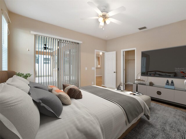11212 Laurel Brook Ct, Riverview, FL 33569 - bedroom featuring a walk in closet, wood finished floors, ceiling fan, and access to exterior