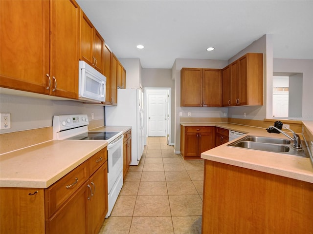 11212 Laurel Brook Ct, Riverview, FL 33569 - kitchen with white appliances, light tile patterned flooring, brown cabinetry, and recessed lighting